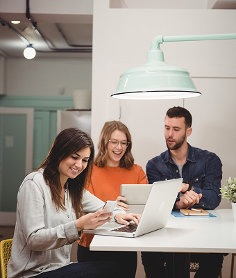 Two people reviewing design work on a screen