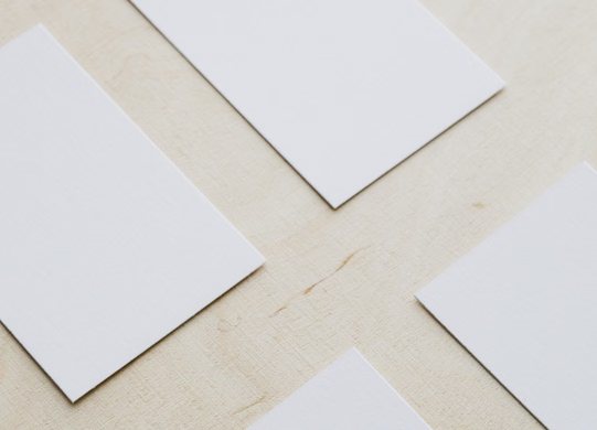 Studio review of printed brand material on a worktable
