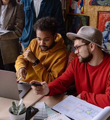Two people reviewing layout options on screen